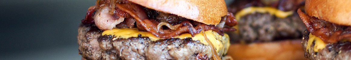 Eating American (Traditional) Burger Hot Dog at Dog Haus restaurant in Canoga Park, CA.